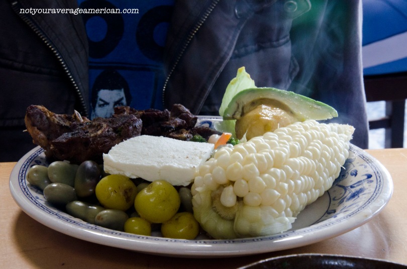 Asado de Borrego came with grilled mutton, a large boiled potato, smaller tubers that are potato-like, sliced avocado, a fresh salad of broccoli, beans, and carrot, habitas (fava beans) and fresh cheese, and the ever popular ear of corn called choclo.